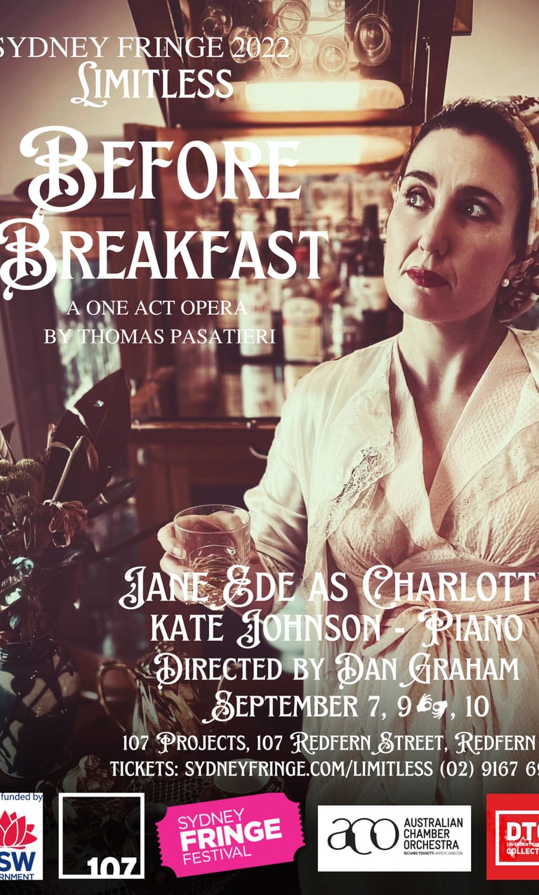 A woman is sitting down with a glass on her hand. She wears a vintage inspired dress from the 1940s.