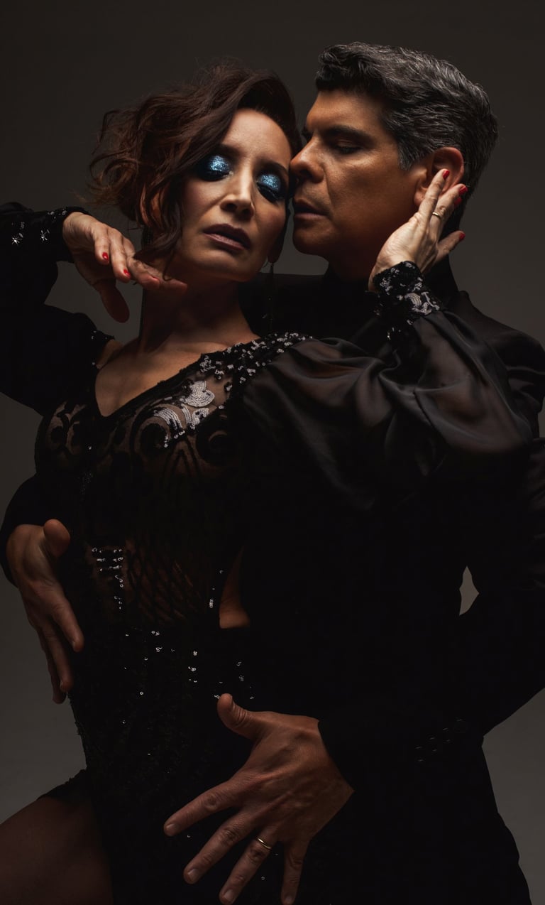 Adrian Veredice & Alejandra Hobert tango pose in the dark. Studio photo by Gustavo Piola