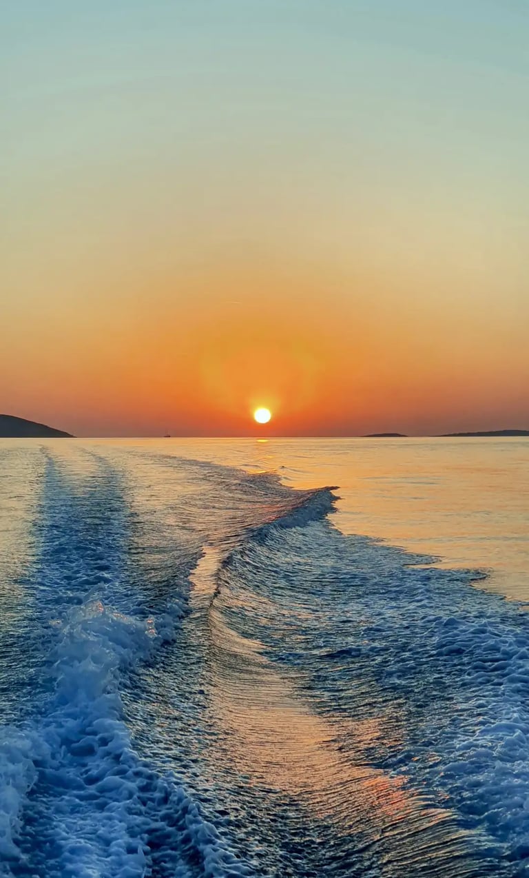Powerful Adriatic sunset with boat wake and propulsion trail captured from a fast speedboat during a sunset tour