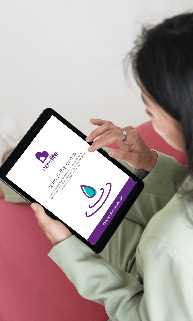 a woman holding a tablet reading her calm in the chaos guide