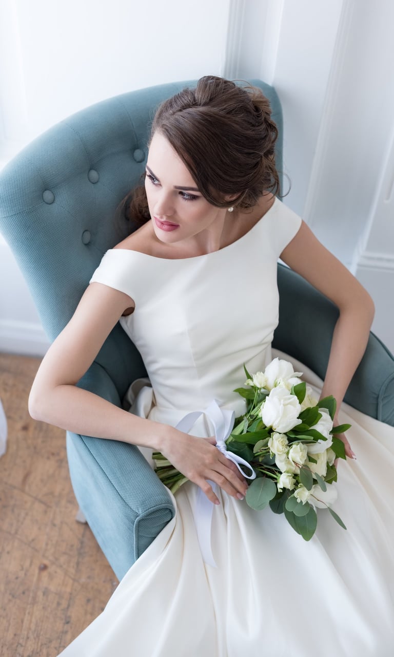 Luxury bridal hair and makeup by Brisbane bridal stylist Liza Formilan, featuring a timeless low bun