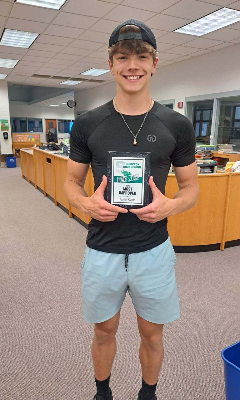 Mobile detailer showing off his most improved award from track.