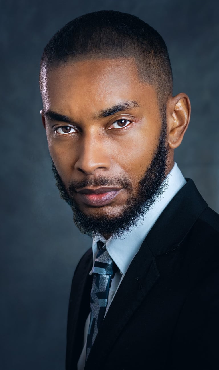 a man with a beard and a tie on a suit