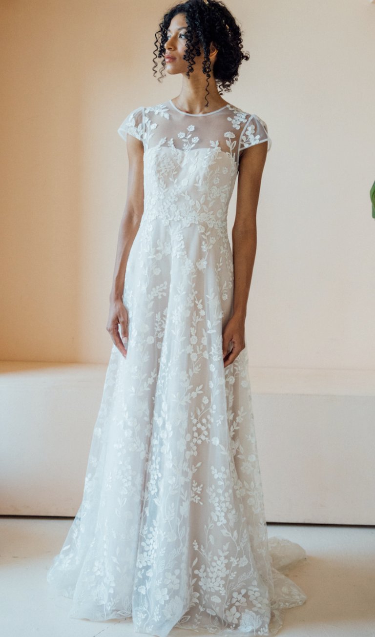 a woman in a white dress with a white dress