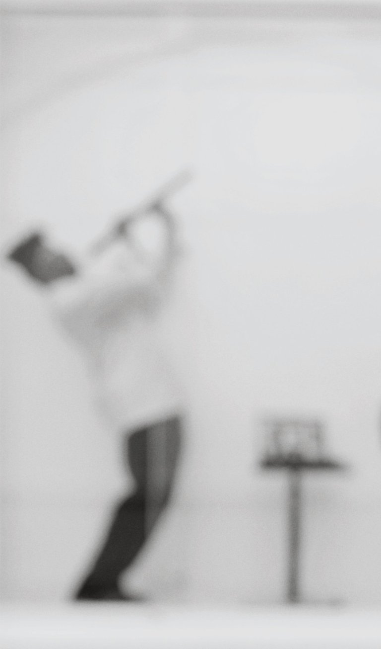 a man in a white shirt and black pants