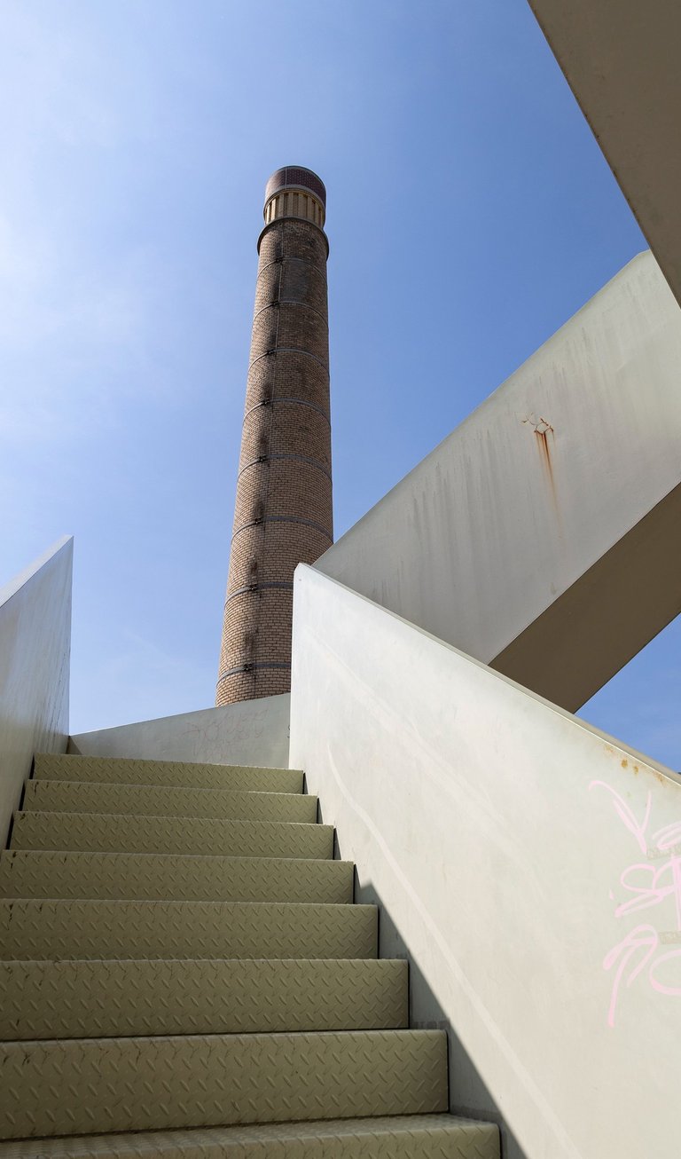 a staircase case with graffiti on it, and a tower