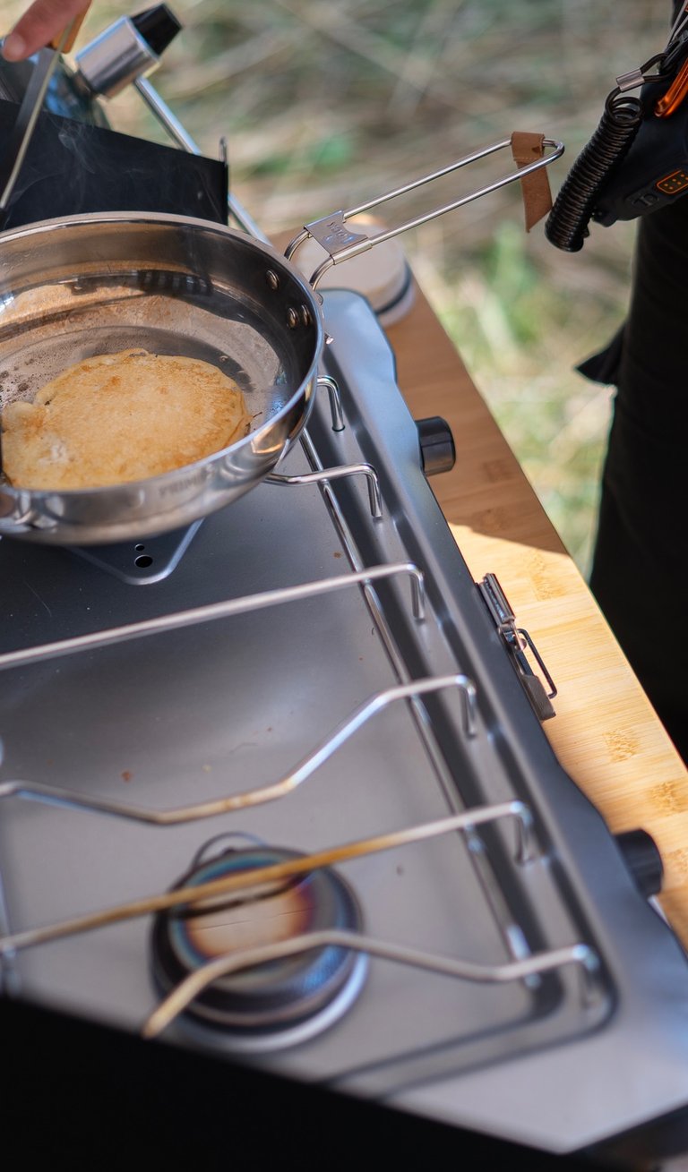Cooking pancakes on a camp stove