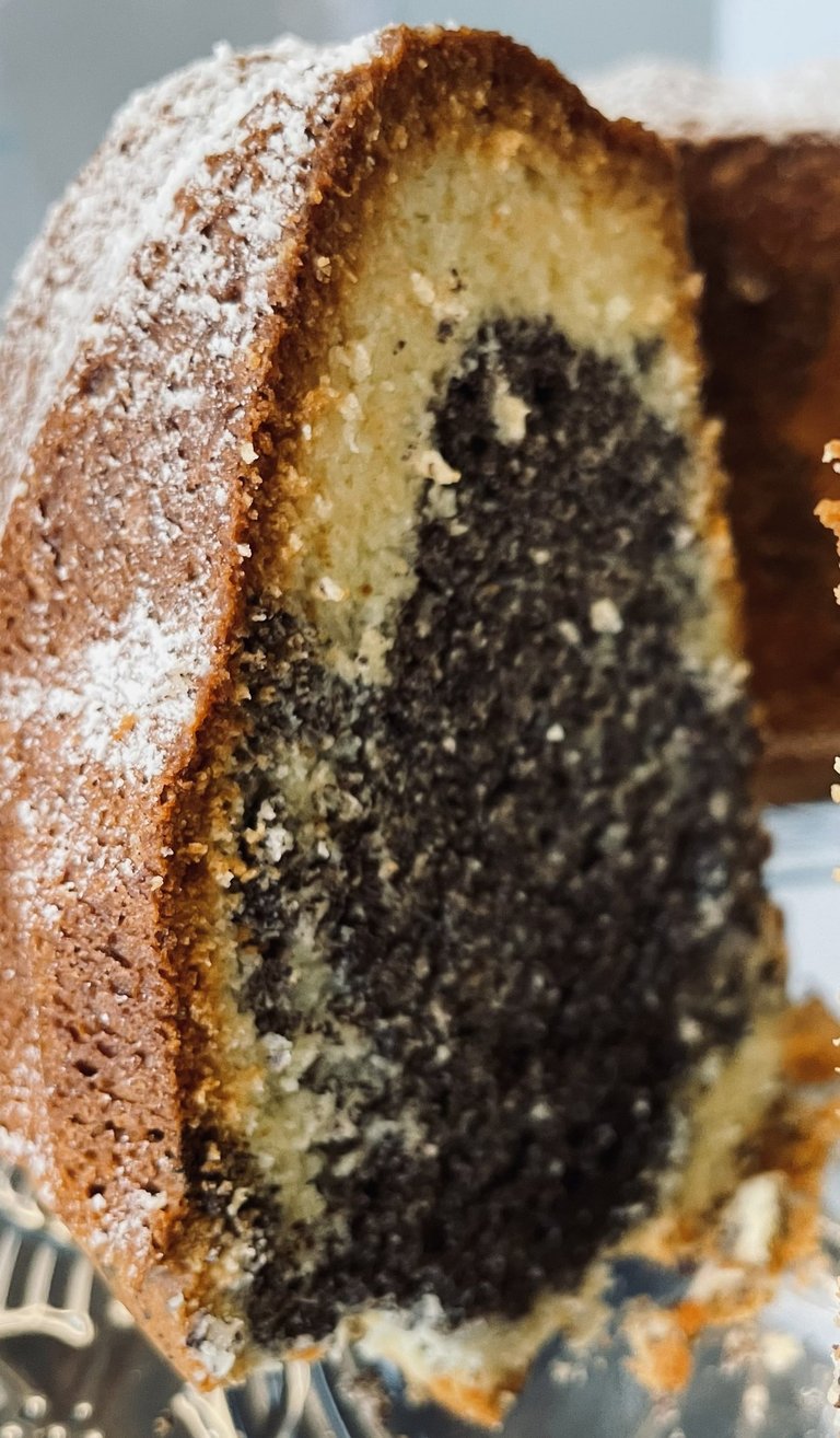 a marble cake with a slice taken out of it