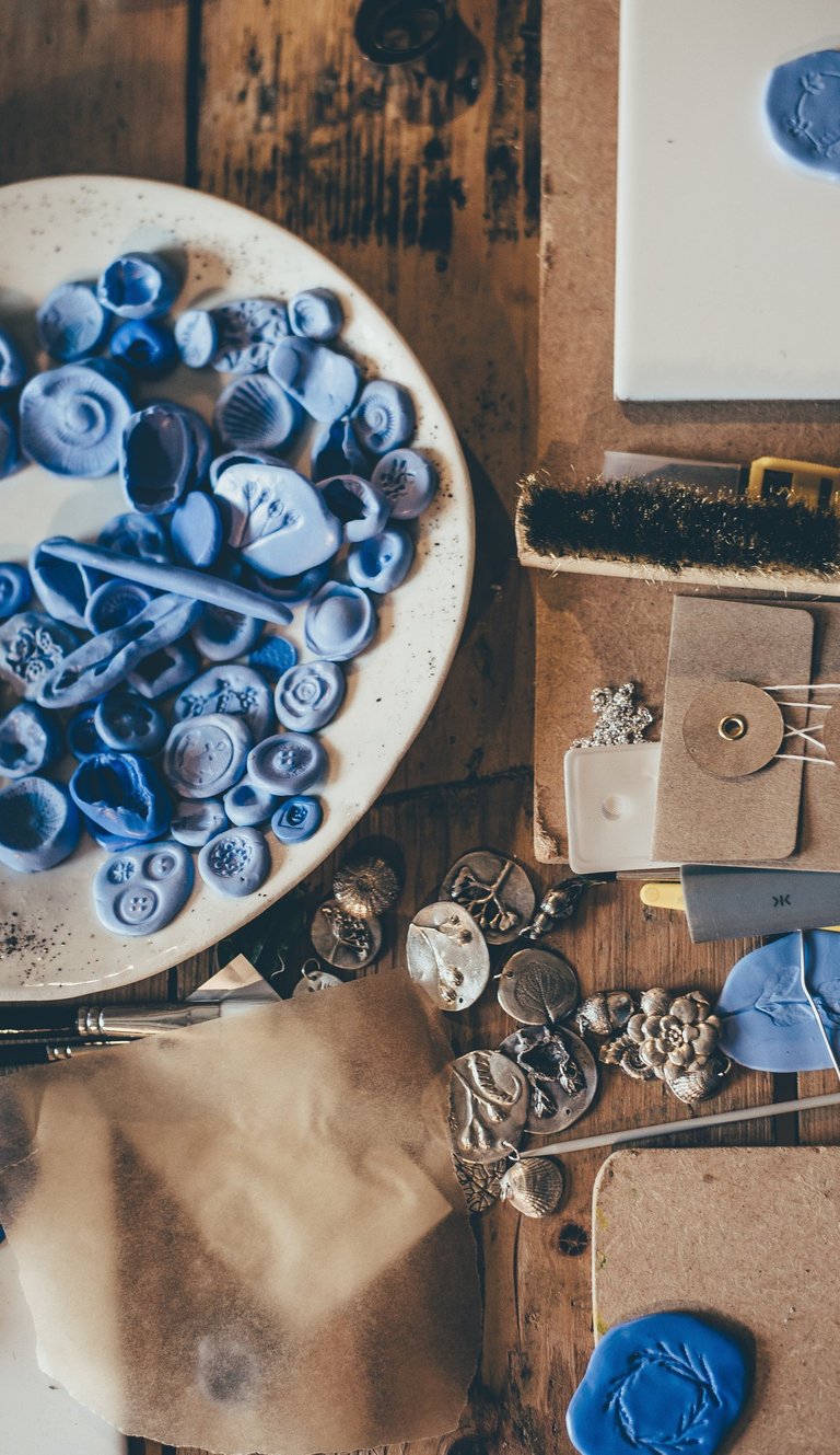 Work desk with random pieces of clay in a bowl