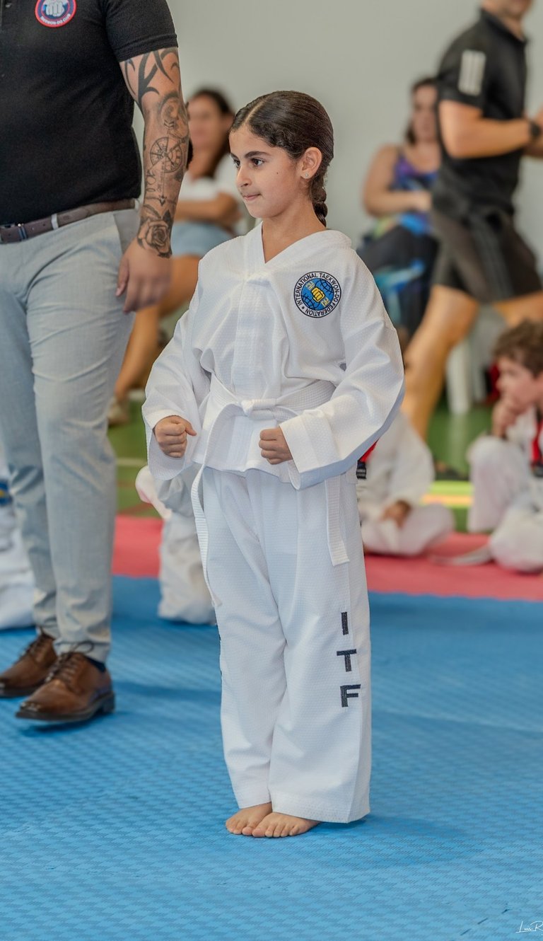 Hwa Rang white belt student enjoying kids taekwondo classes in Dubai