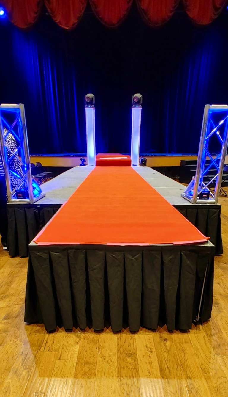 Red Carpet on a runway style stage, available for rent from MadDawgs Entertainment