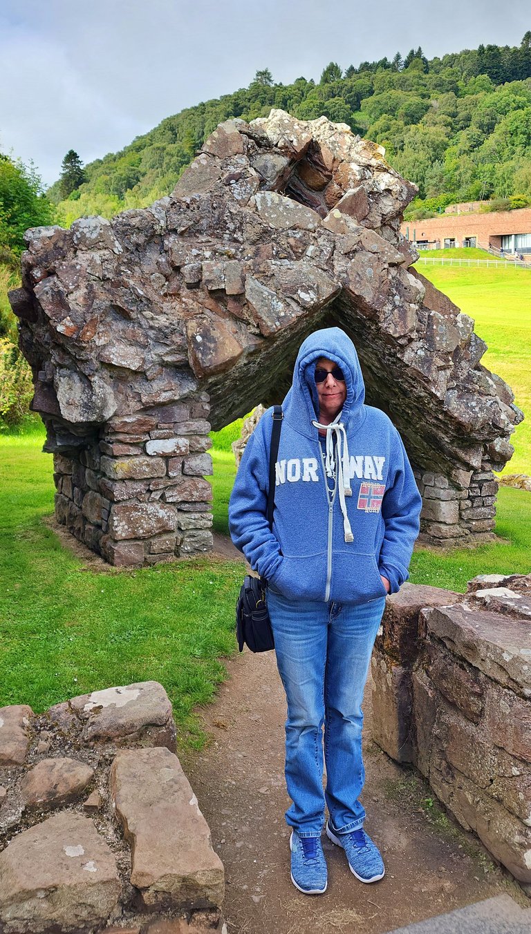 Lady is cold at Urquhart Castle in Scotland