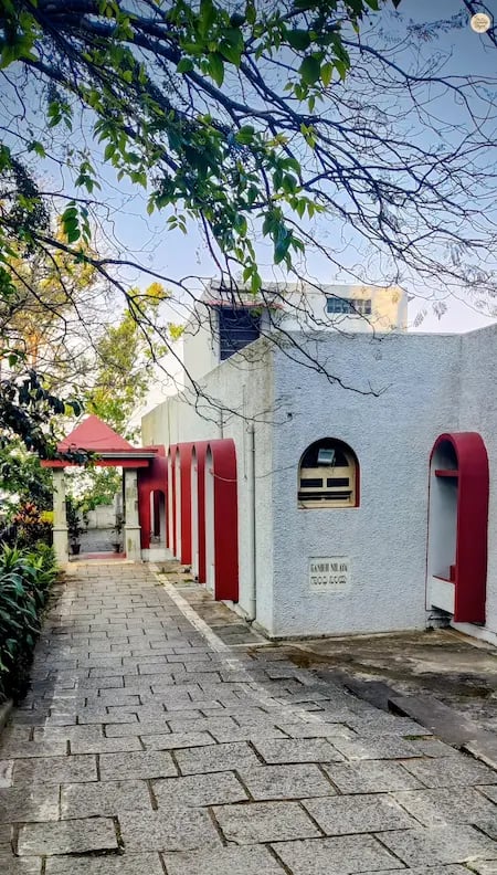 Gandhi Nilaya, a colonial-era bungalow turned heritage guest house at Nandi Hills, surrounded by lush gardens and hill views