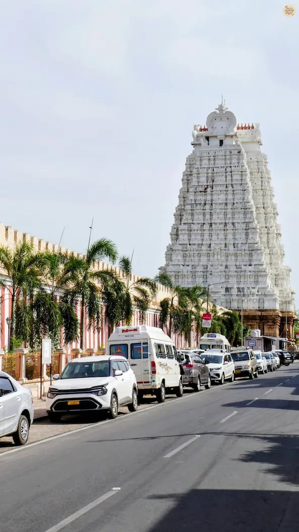 White Gopuram of Sri Ranganathaswamy Temple with massive outer walls resembling a fortress in Srirangam, Tamil Nadu.