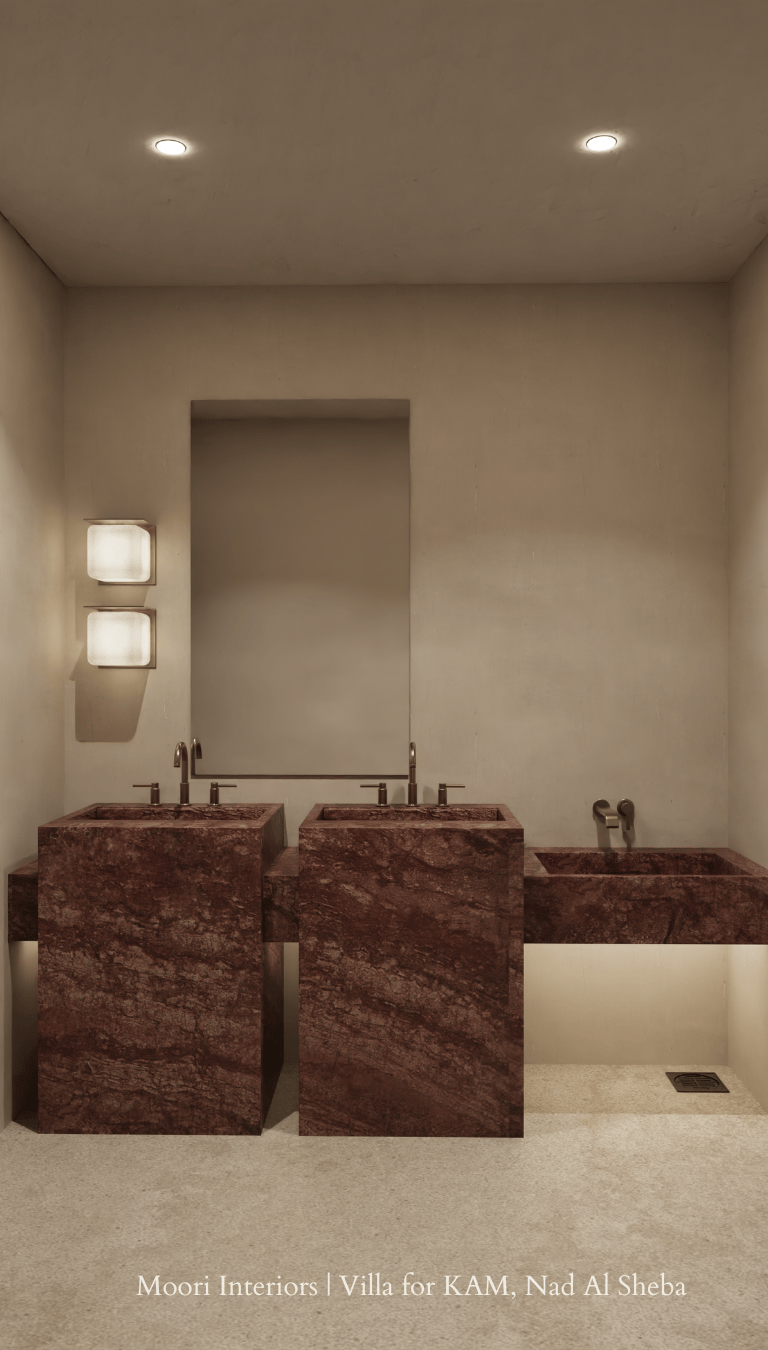 Bathroom interior with warm cove lighting beneath the right sink and wall-mounted lights