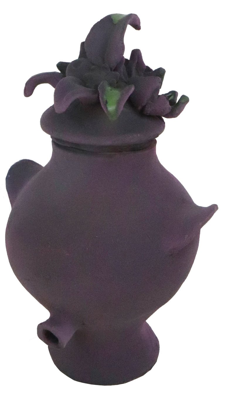 a purple vase with flowers on it