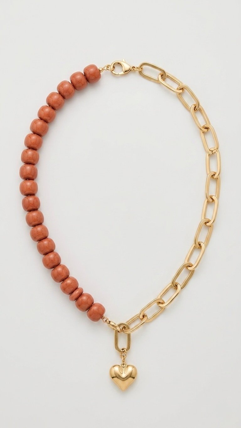 Gold chain necklace with brown beads and a gold heart pendant charm.