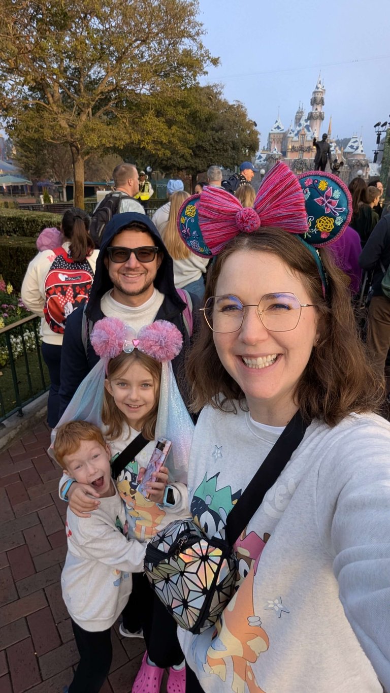 Katie Matzenbacher, Travel Agent, and her family in front of Sleeping Beauty Castle in Disneyland