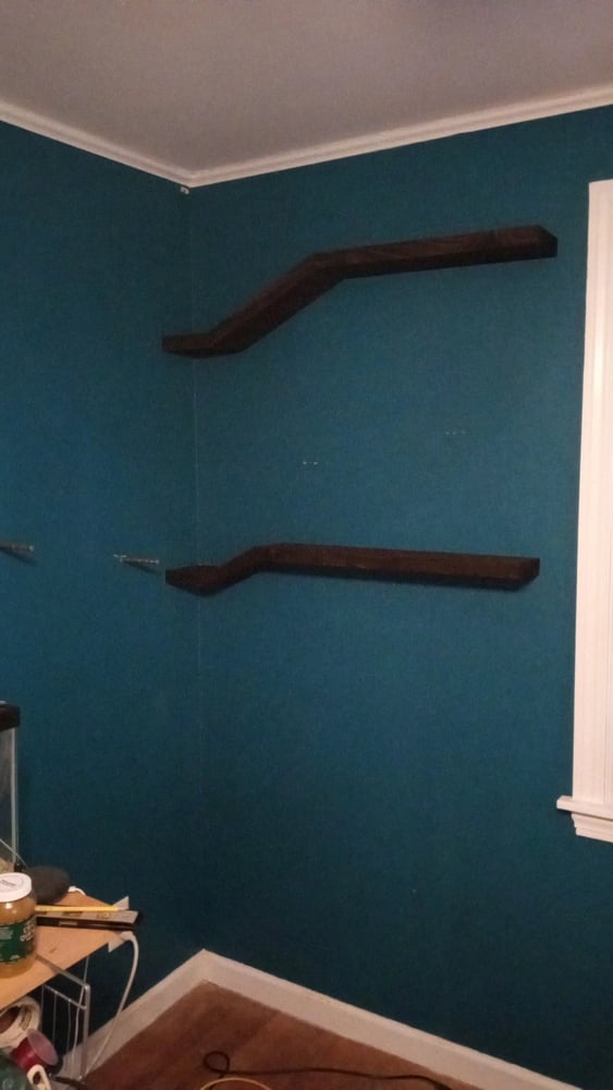 2 floating shelves installed, steel posts ready for another to be mounted