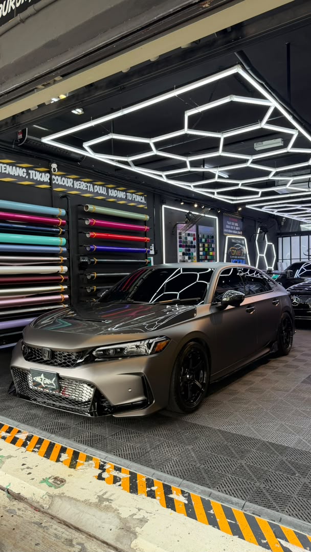 Honda Civic wrapped in matte black vinyl with gloss accents