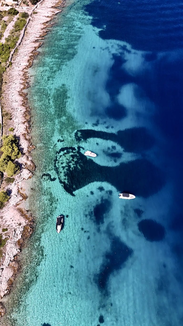 Aerial panoramic view of Drvenik Mali Island, seen on a private boat tour off the coast of Split, Croatia.