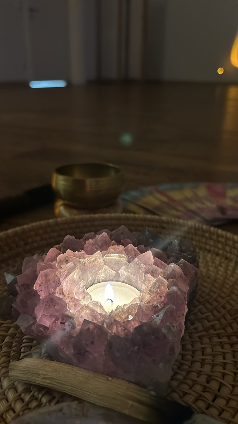 a candle with a candlelight on a table