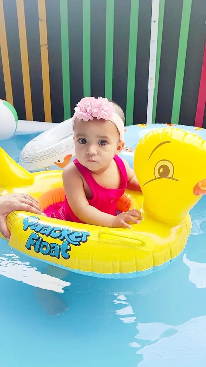 child playing with water aith yellow duck at Enfant pre school Ghaziabad