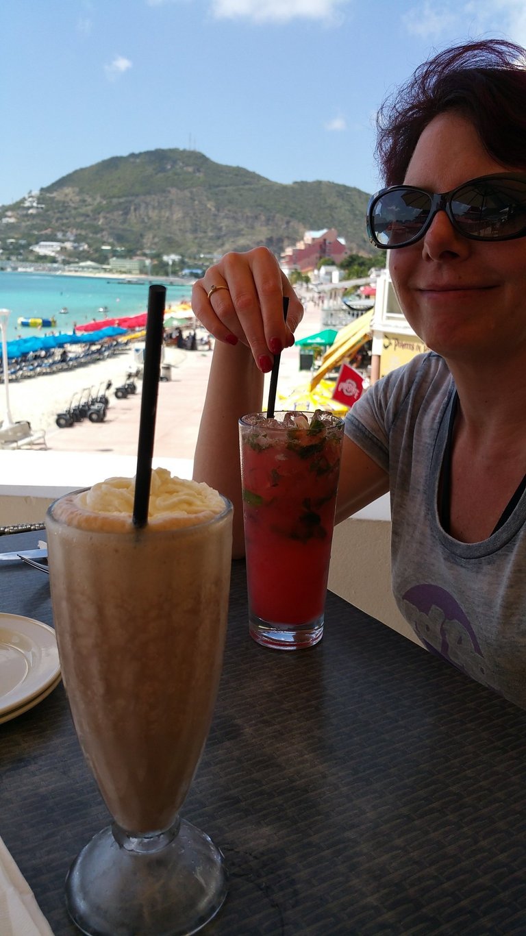 Lady enjoys a drink on St. Maarten
