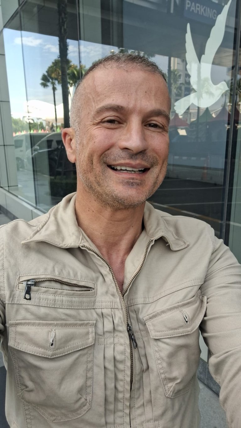 Male therapist wearing beige coloured jacket