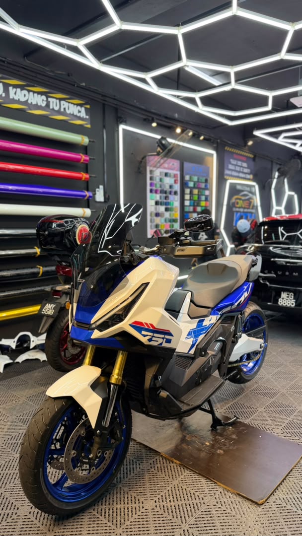 Honda ADV 750 scooter wrapped in cream and blue custom livery