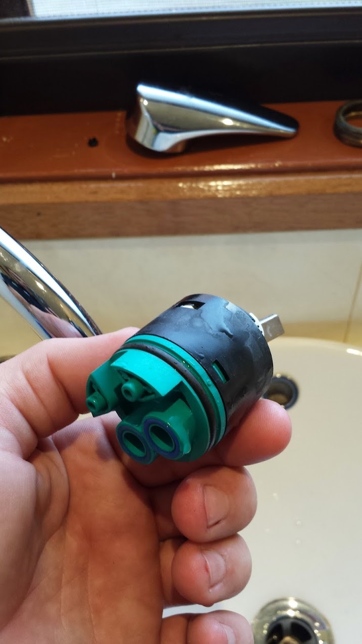 Old mixer cartridge about to be replaced