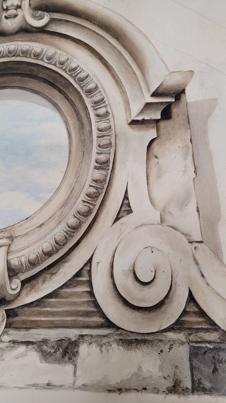 Détails d'un décor peint en trompe-l'oeil, imitation de matière, fausses moulures.