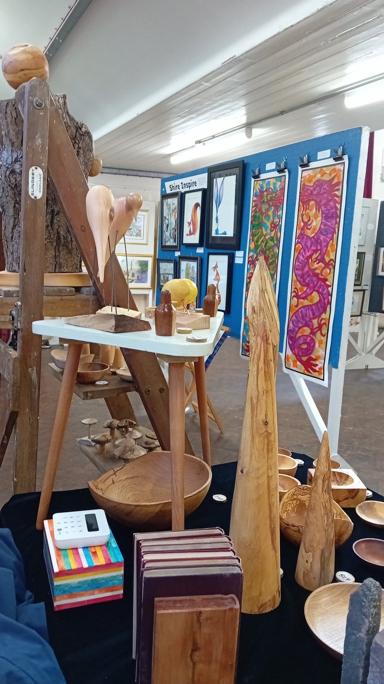 Our stall at the exhibition with paintings behind