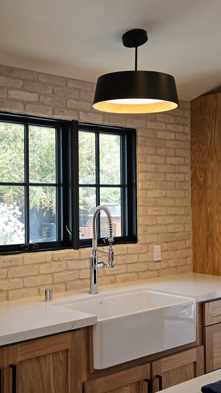 Modern kitchen lighting installed during a residential electrical renovation