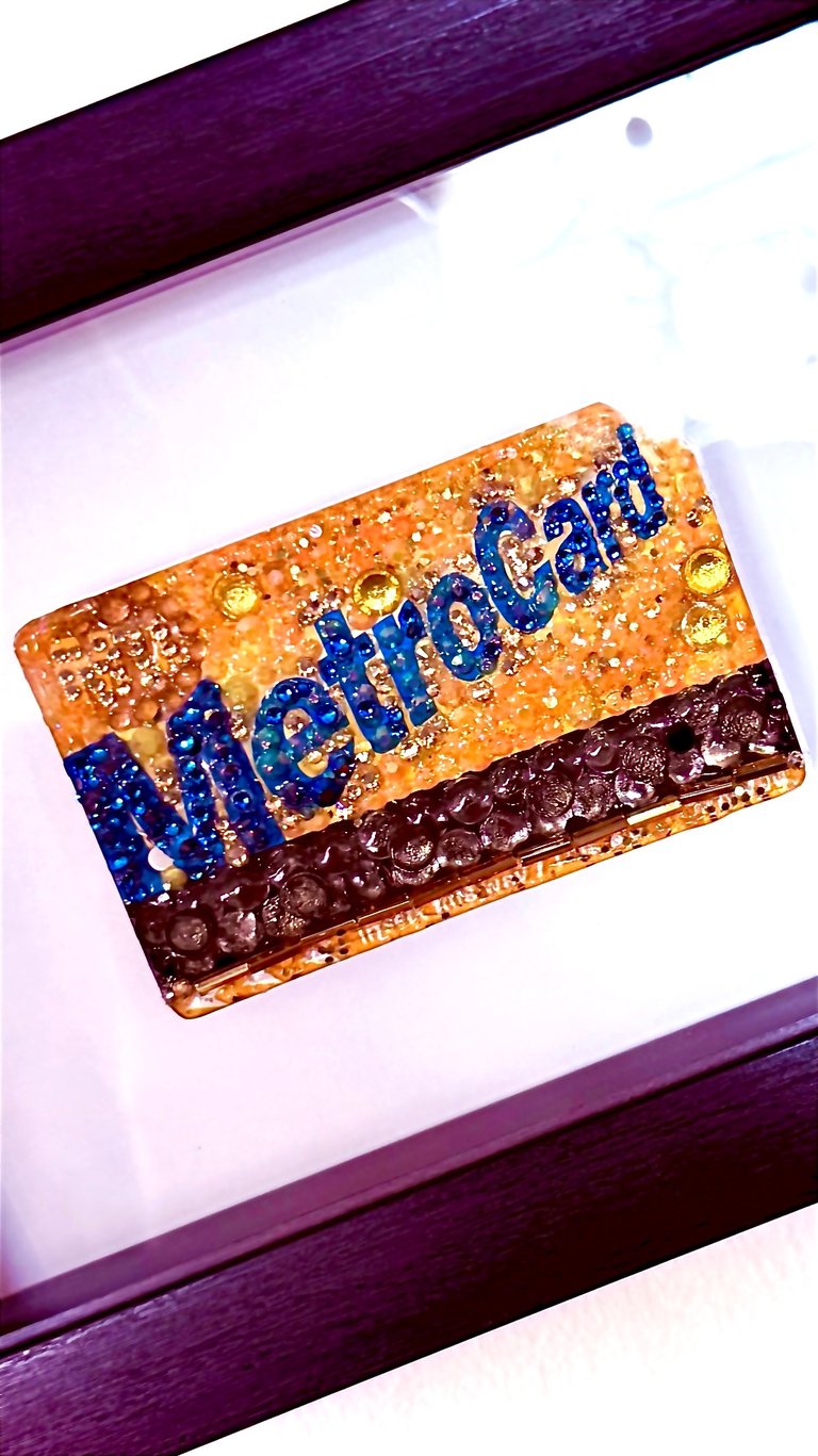 framed work of mterocard covered in crystals