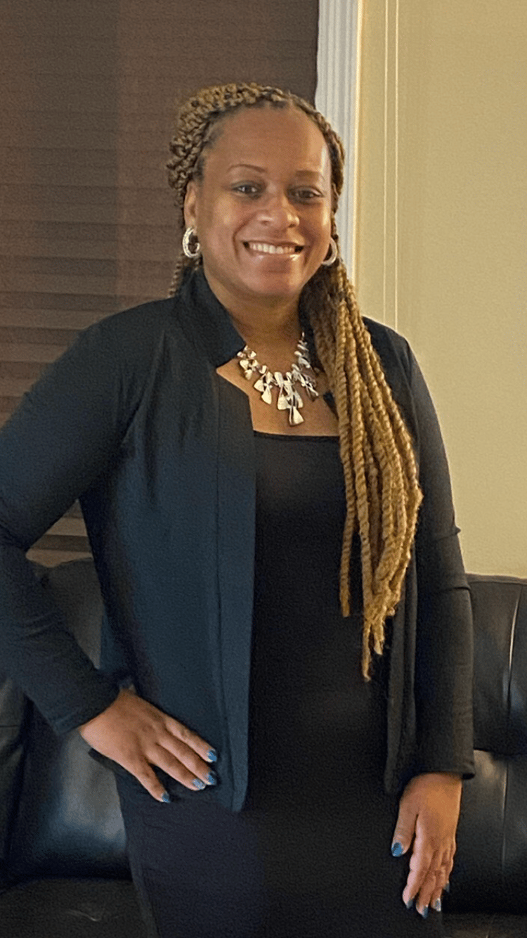 a woman in a black shirt and a black jacket