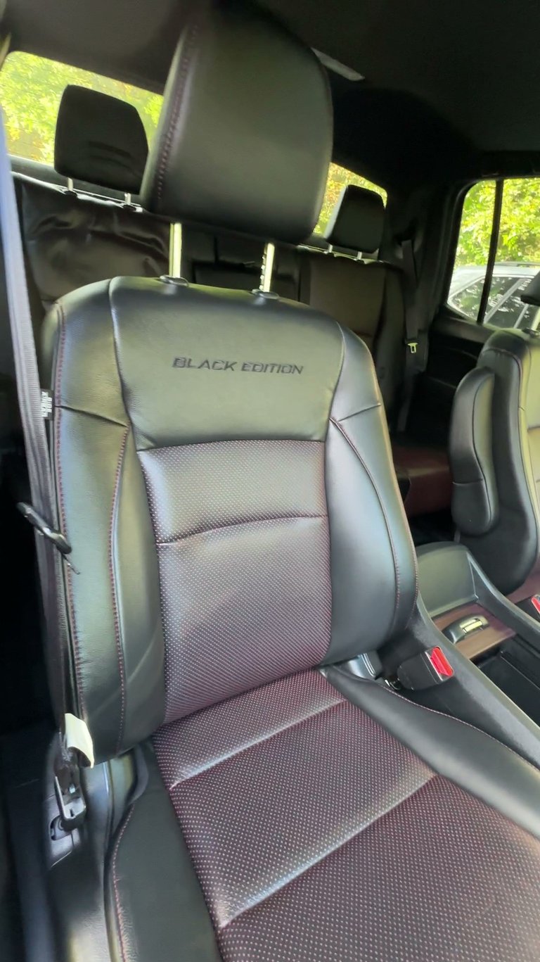 professional car detailing of interior leather seats for a special black edition truck