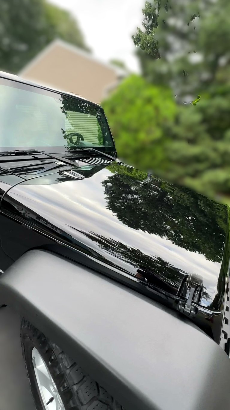 glossy black jeep after car detailing in ct neighborhood
