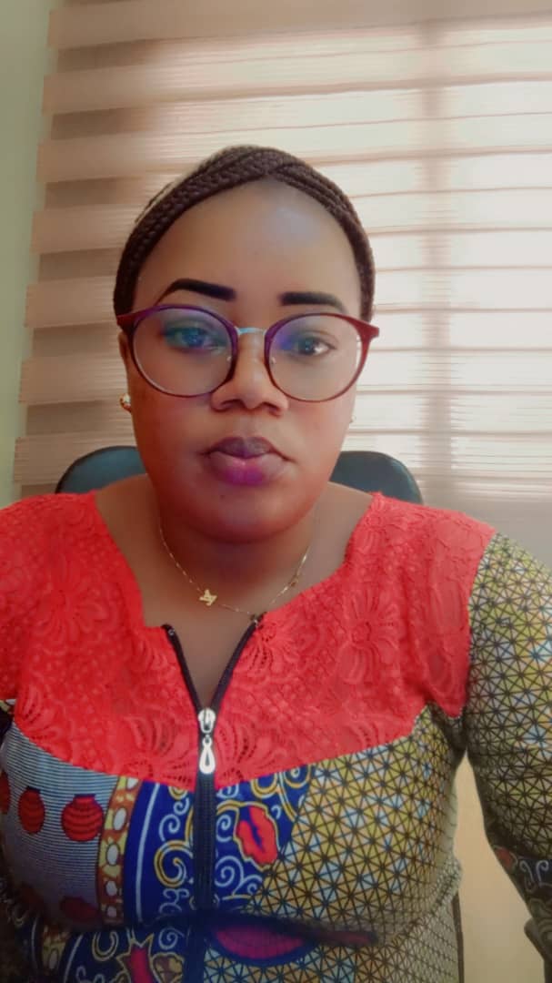 a woman with glasses and a red shirt