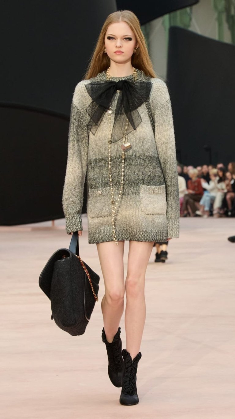 Ombre knit sweater dress with sheer black bow at Chanel FW25/26.
