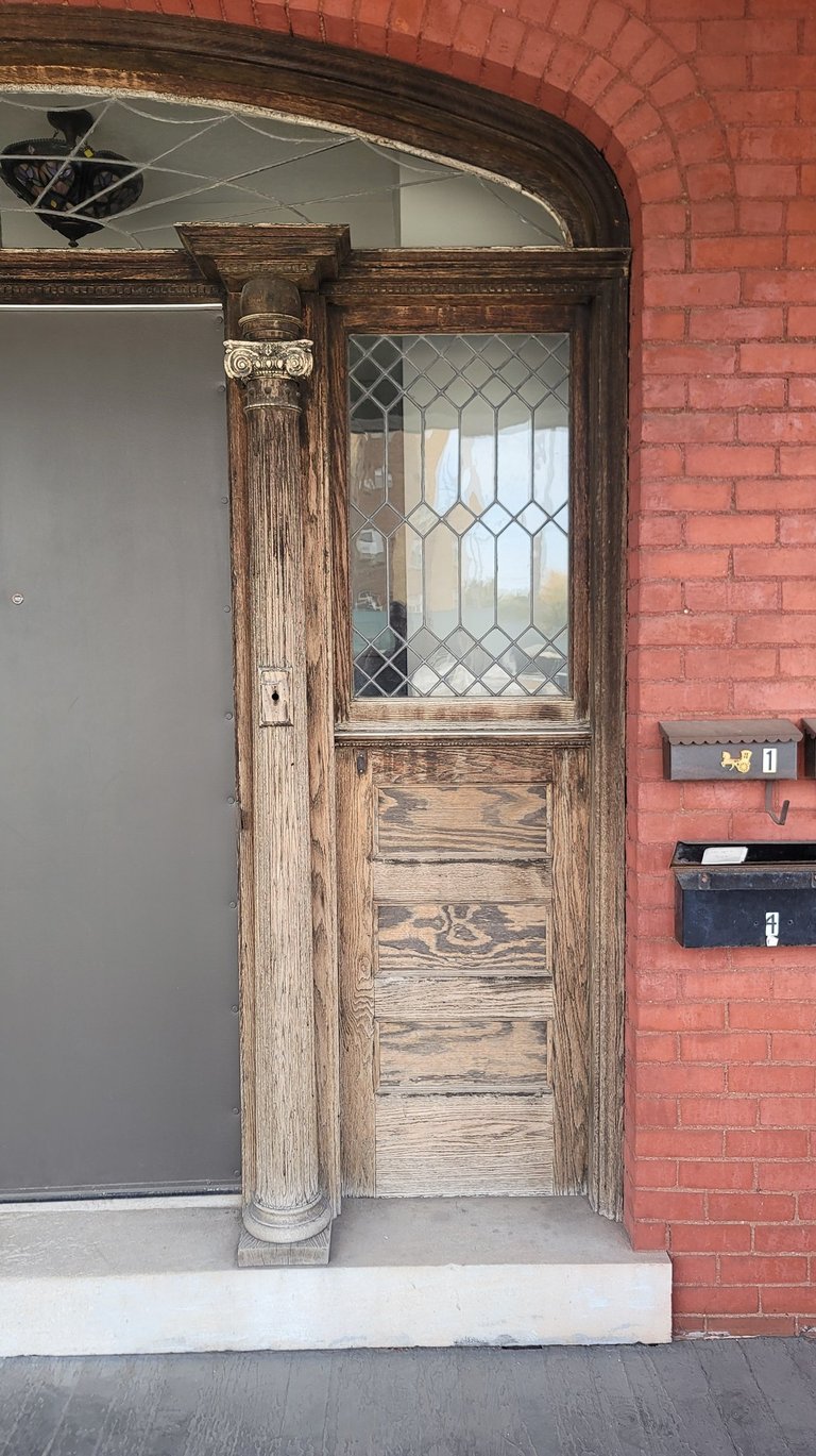 American Painting Specialist Fort Wayne, Indiana refreshing old wood doors to 'like new'.