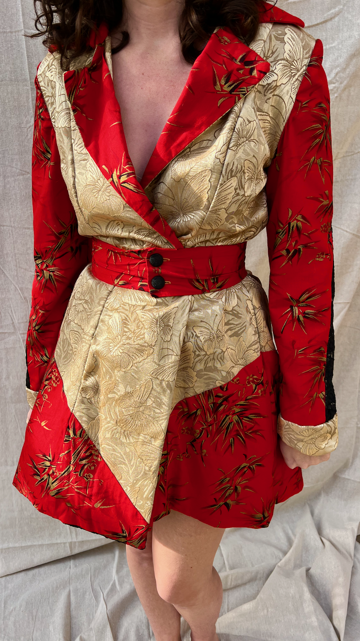 The front of red cotton, black lace, and gold butterfly coat