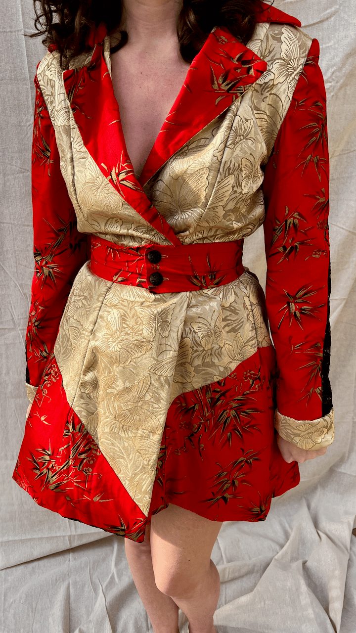 The front of red cotton, black lace, and gold butterfly coat