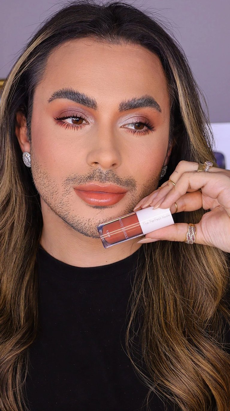 a man with a beard and a black shirt