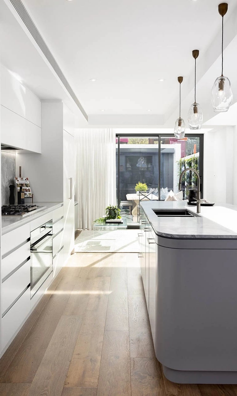 Modernist culinary space with custom-made joinery, climate-controlled wine storage, and natural light amplification