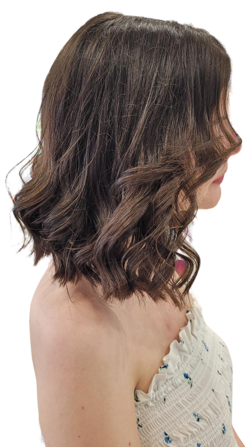 Woman with soft, layered haircut and blow-dry finish