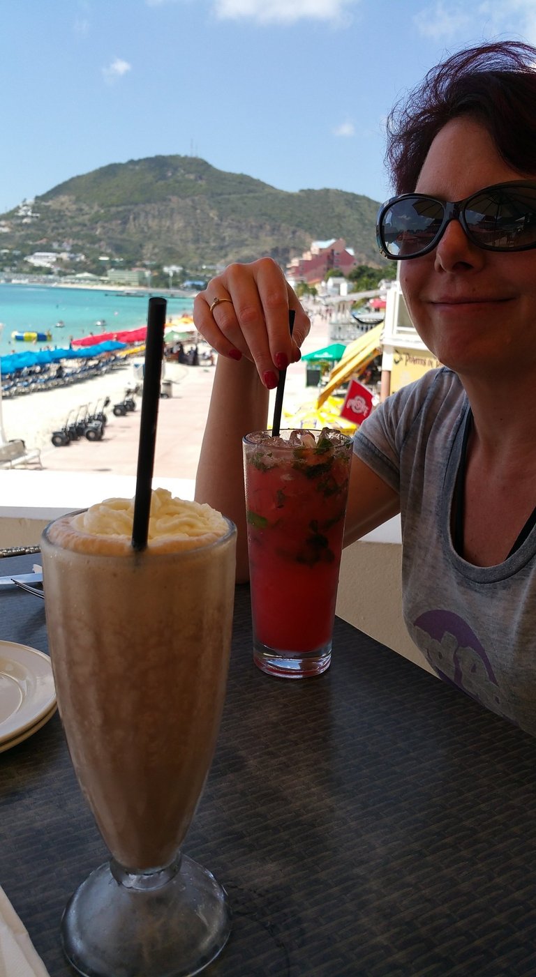 Lady enjoys a drink on St. Maarten