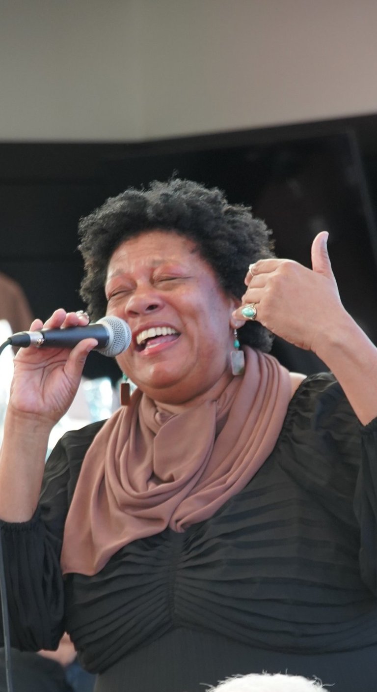 Singer-Songwriter Rhonda Merrick performing a song she wrote with Off The Hook Chamber Orchestra