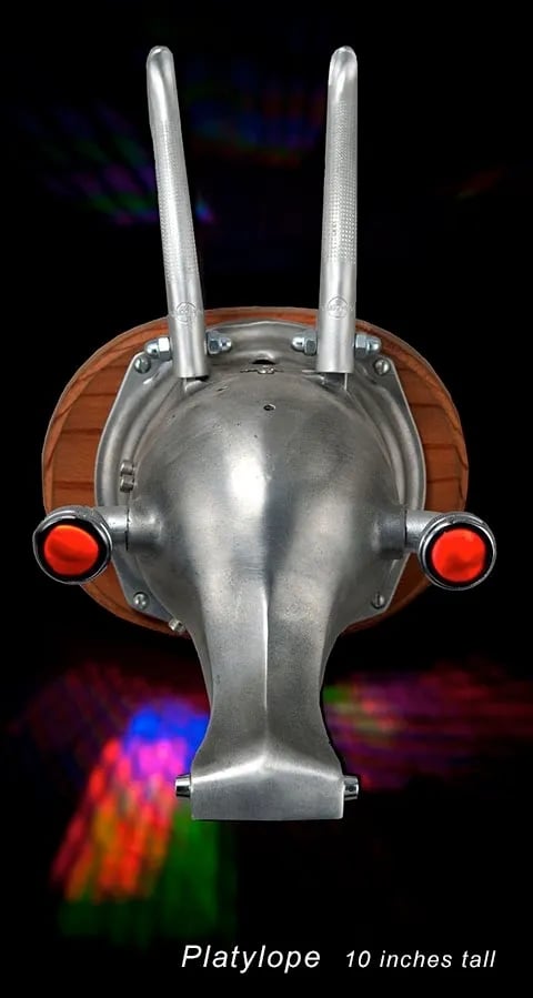 Mounted metal animal head sculpture named Platylope by assemblage artist Tal Avitzur.