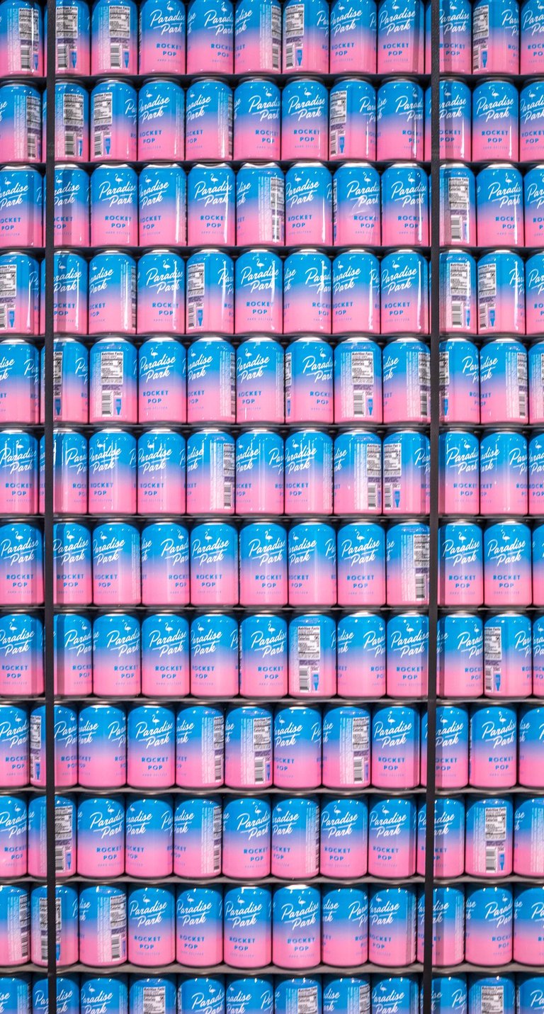 a bunch of cans of beer in a brewery